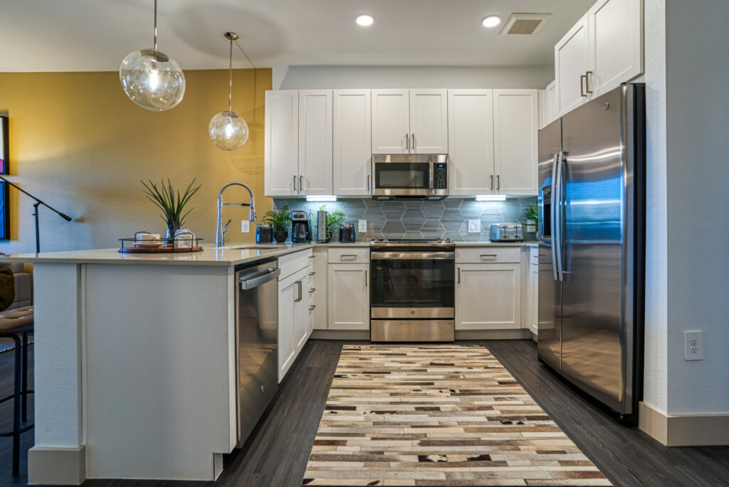 Kitchens Ready for Anything - luxury apartment kitchen with upscale features such as Stainless steel-styled GE® appliances, including front control ranges and side-by-side refrigerators with in-door ice and water
