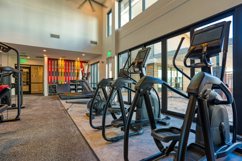 Break a Sweat - Wellness center featuring strength and cardio equipment with cubbie and towel storage